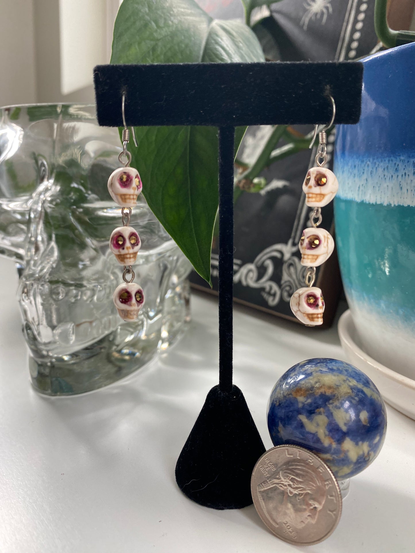 Long earrings: Triple mid size white skulls HA23-EC0037
