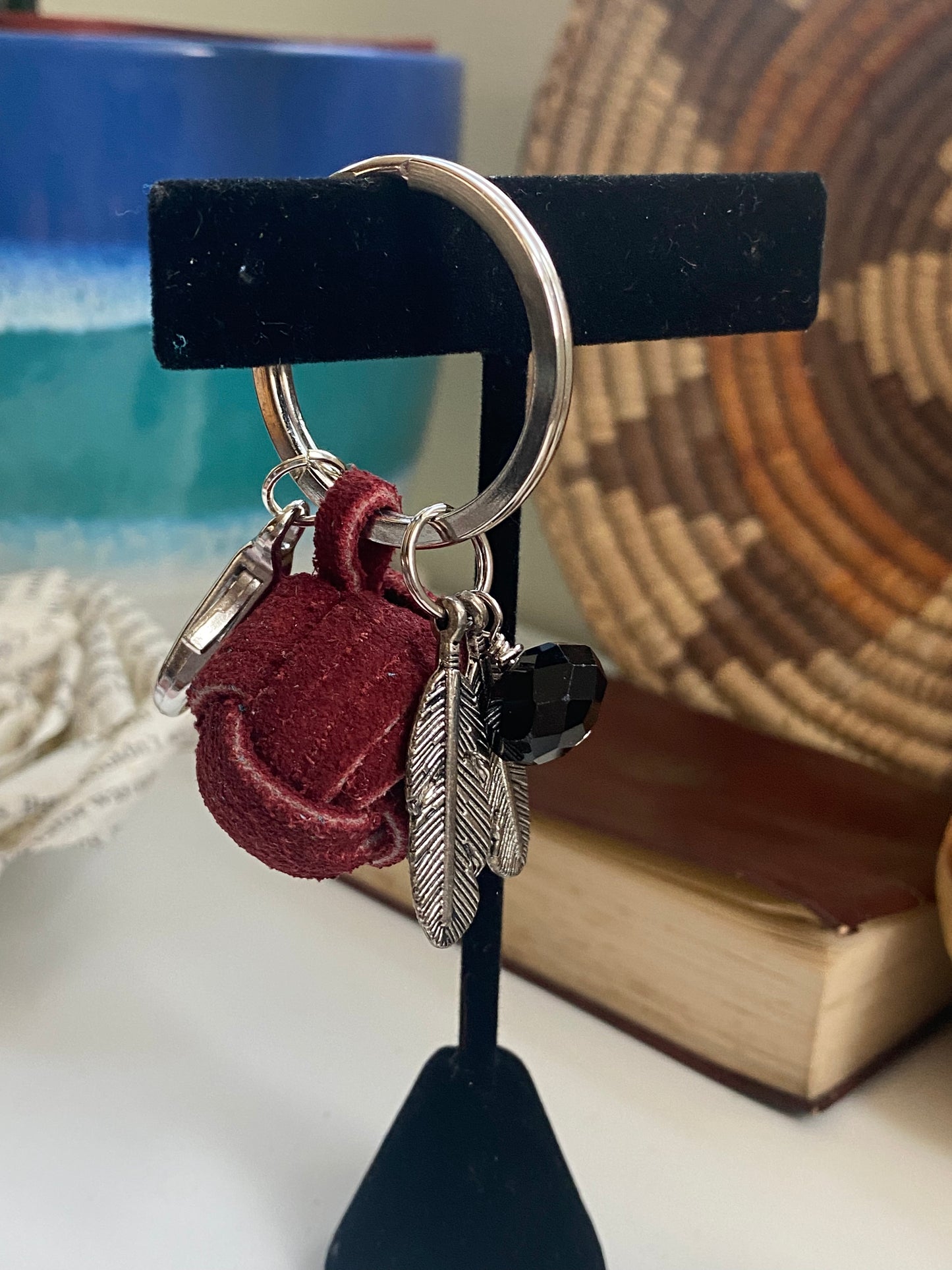 Red suede ball with feather charms and onyx bead keychain with a lobster clasp KC23-KC0019