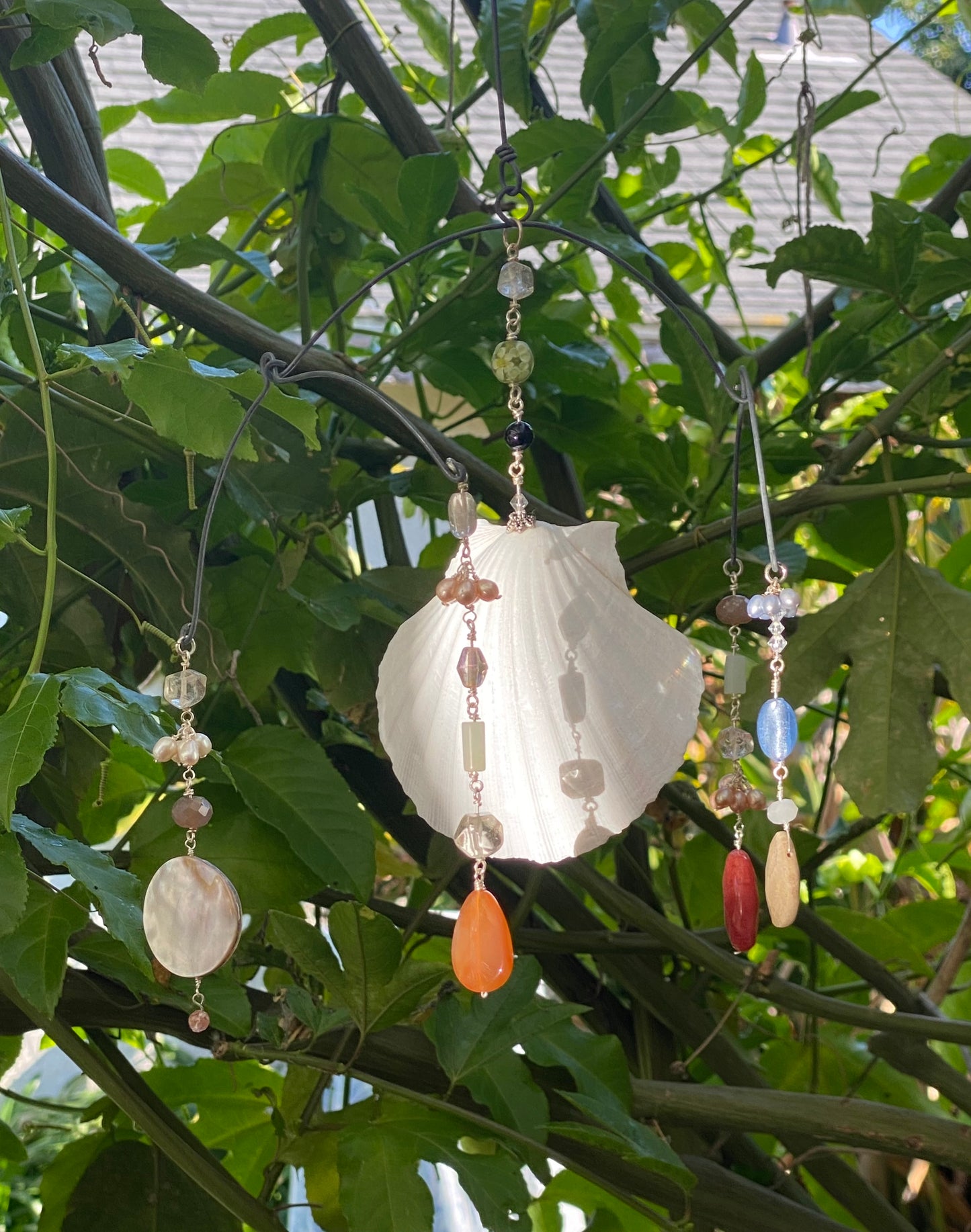 Sun Catchers: Large shell in the middle with Circular carved shells, Strawberry Quartz, Petrified corals, jasper, freshwater pearls, quartz, Carnelian etc. SC23-CO0008